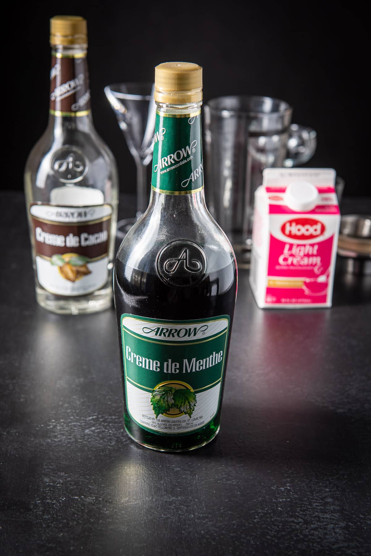 Green creme de menthe, creme de cacao and cream for the grasshopper cocktail