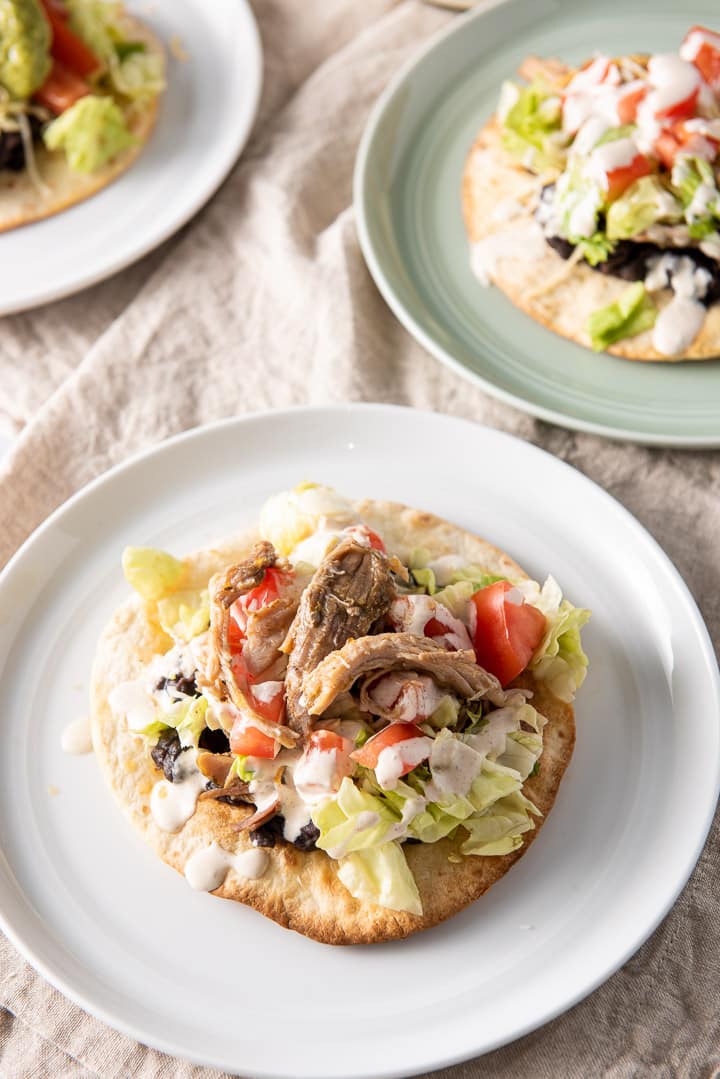 Close up view of the pork on top of the tostadas