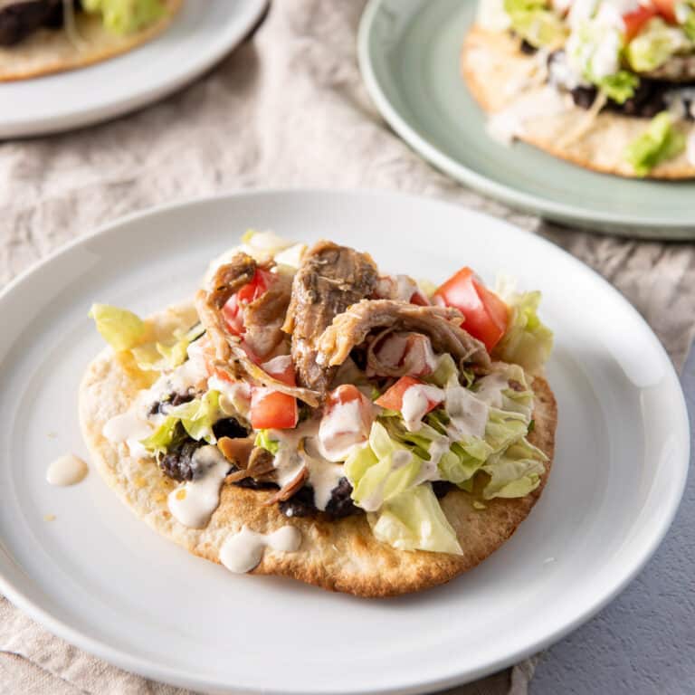 Pulled pork on top of one of the tostadas - square