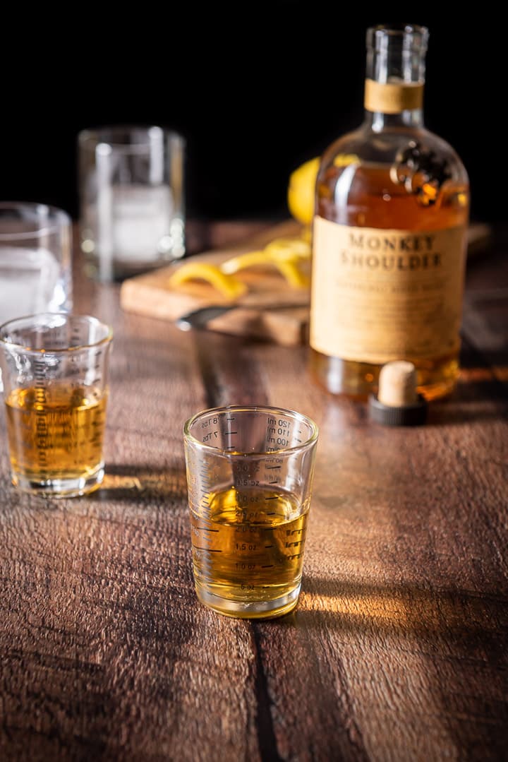 Scotch poured out for the rusty nail cocktail