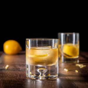 Two glasses of the rusty nail cocktail - square