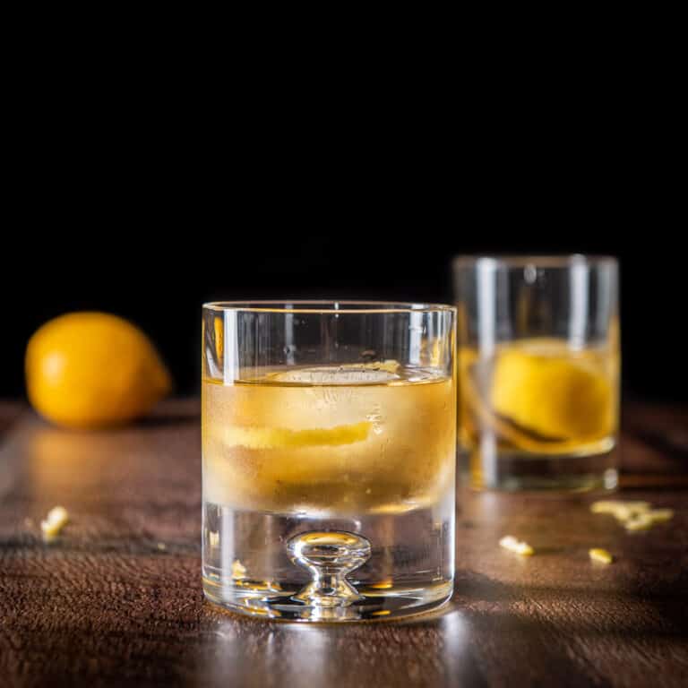 Two glasses of the rusty nail cocktail - square