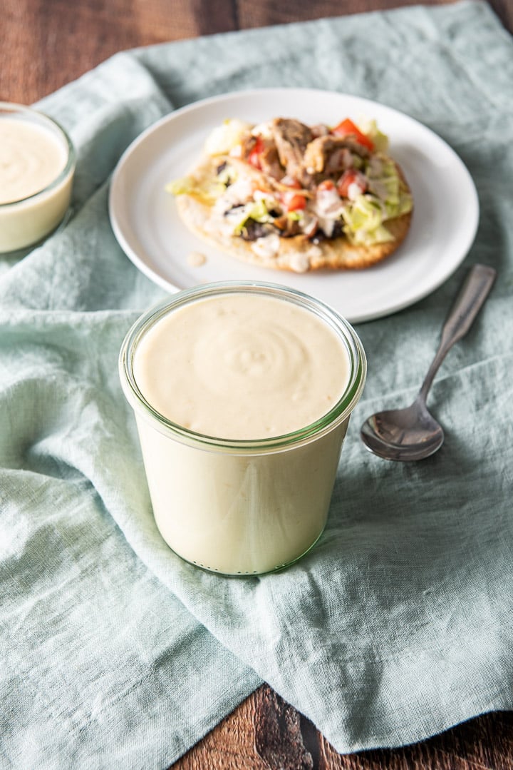 Higher view of the sauce with a pork tostada in the background