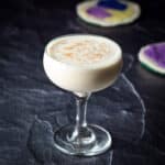 Nutmeg grated on the brandy alexander in a coupe glass - square