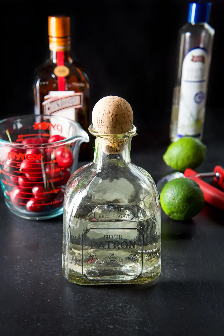 Tequila, Cointreau, simple syrup, limes and cherries for the cocktail
