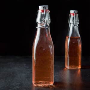 Two bottles of the infused vodka in vertical view