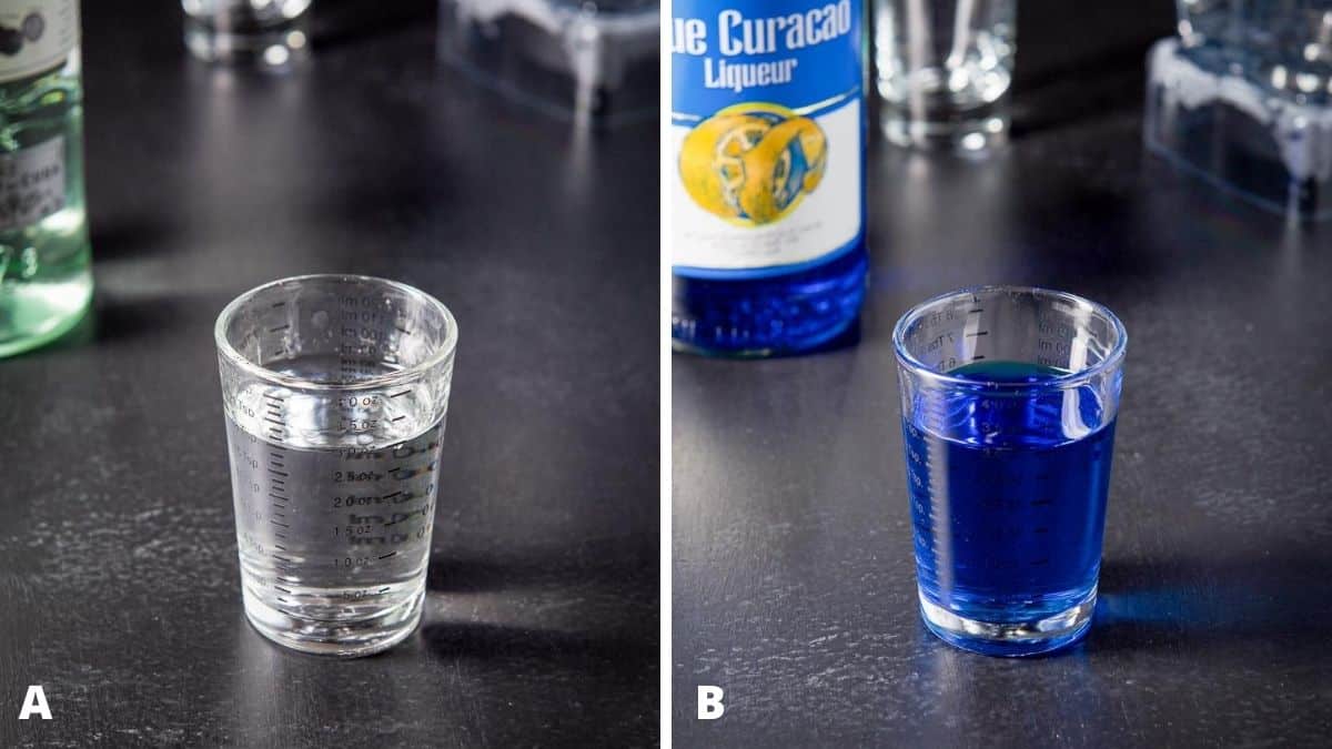 Rum and blue curacao poured out with the bottles in the background