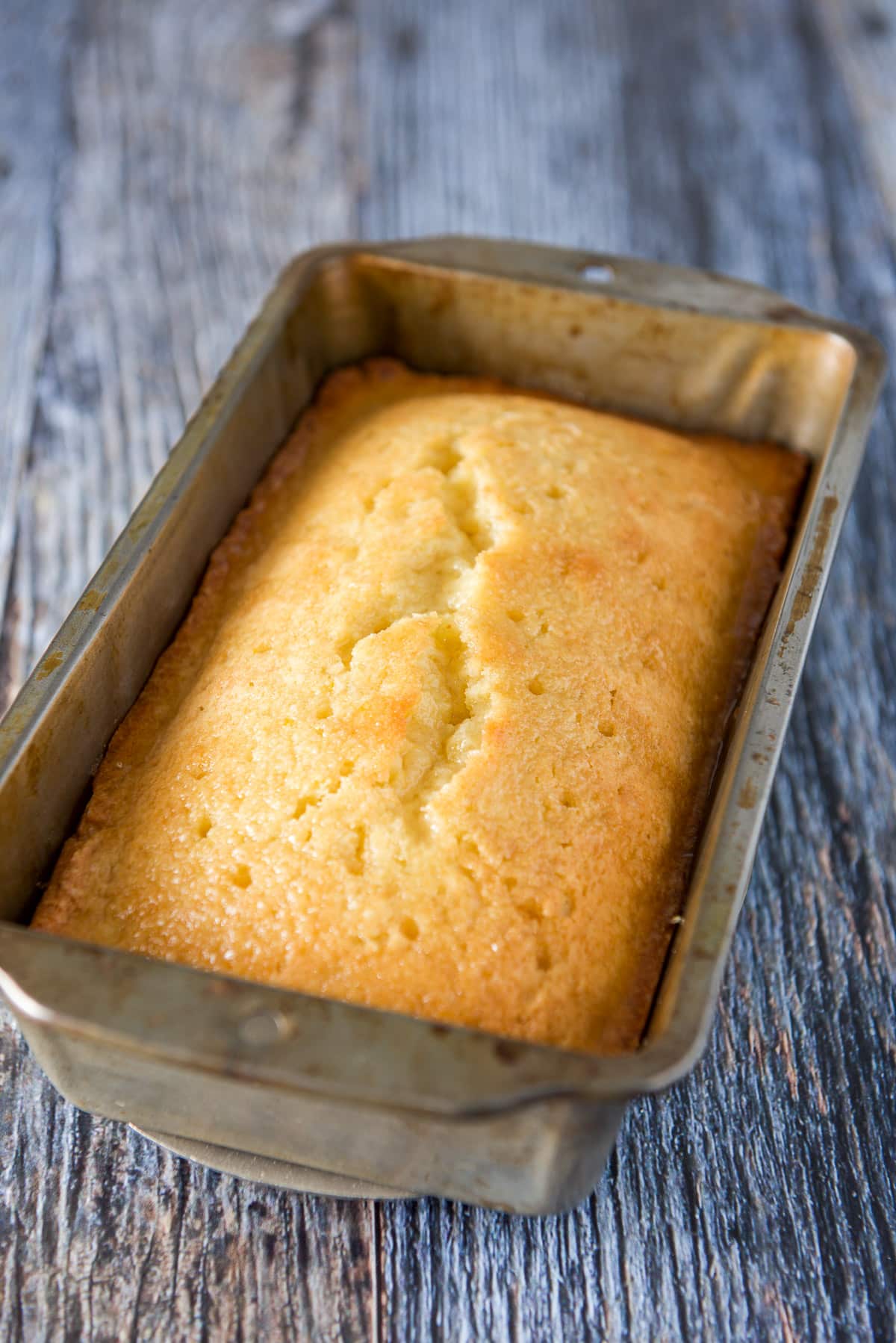 Bread with the glaze on it but still in the pan