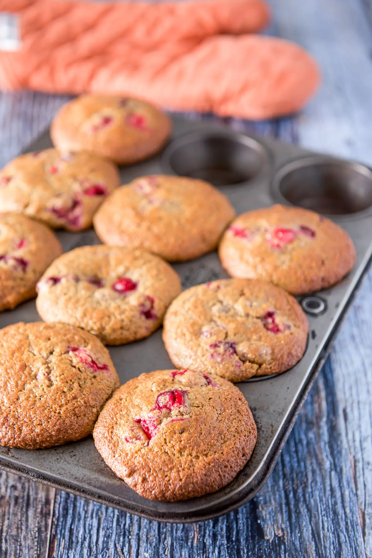 Cranberry muffins straight out of the oven still in the pan