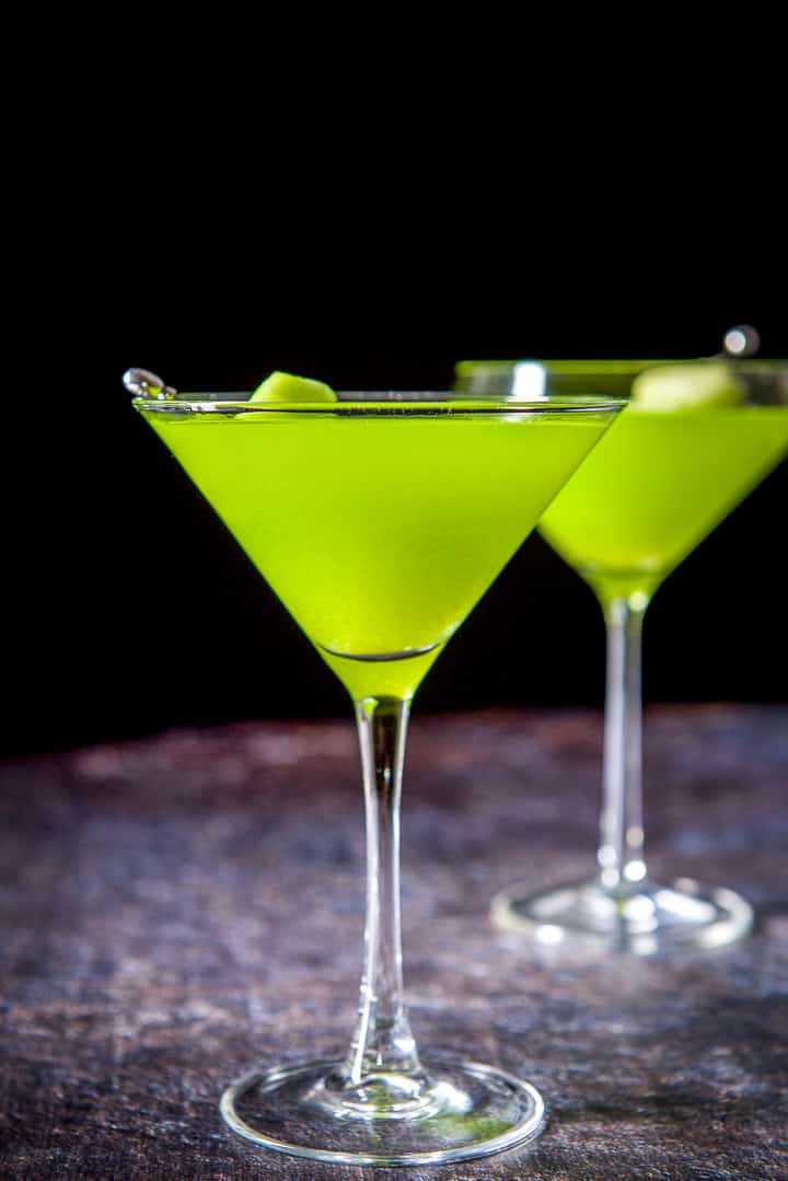Vertical view of the classic glass filled with the melon drink with the fruit in it
