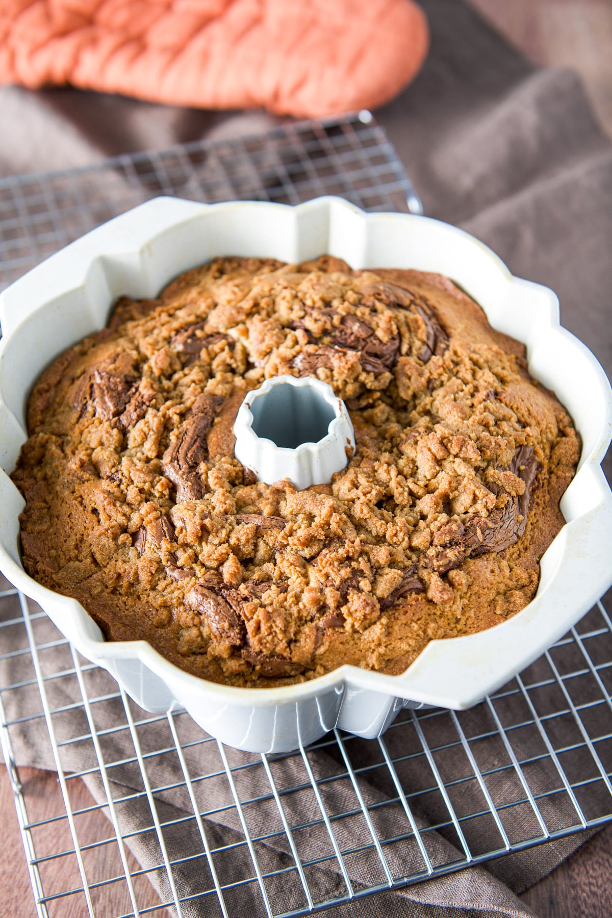 The Nutella coffee cake cooling in the pan on a wire rack