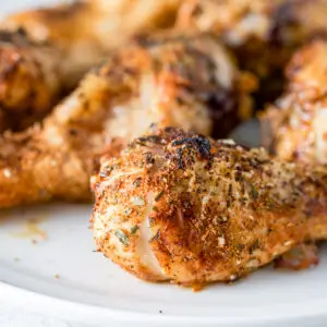 Close view of a drumstick with lots of herbs on it - square