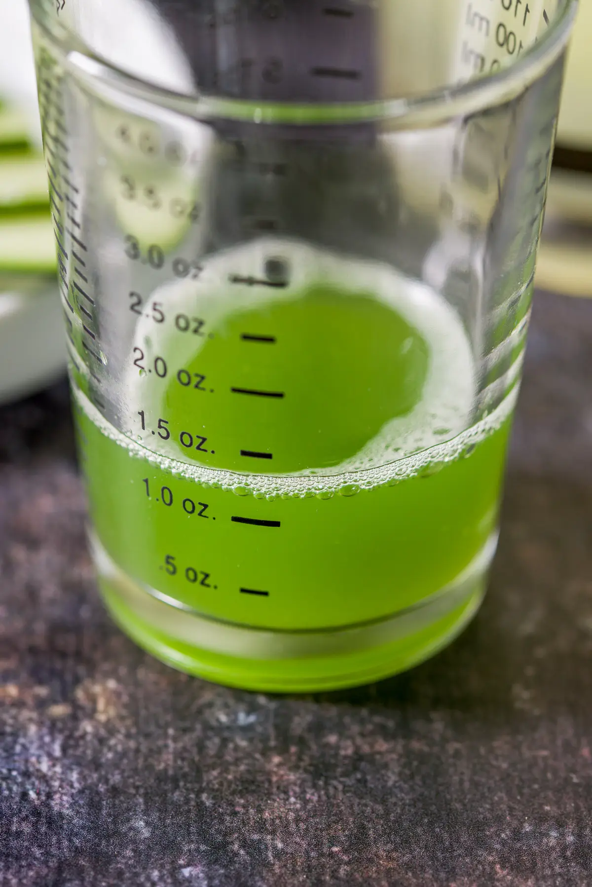 cucumber juice in a measuring glass