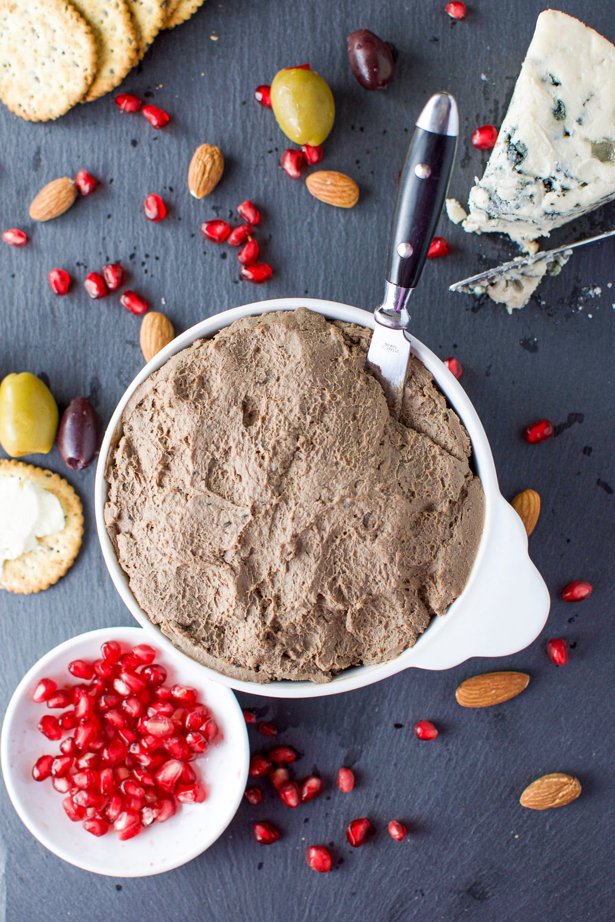 Overhead view of the pate, crackers, nuts, cheeses and seeds