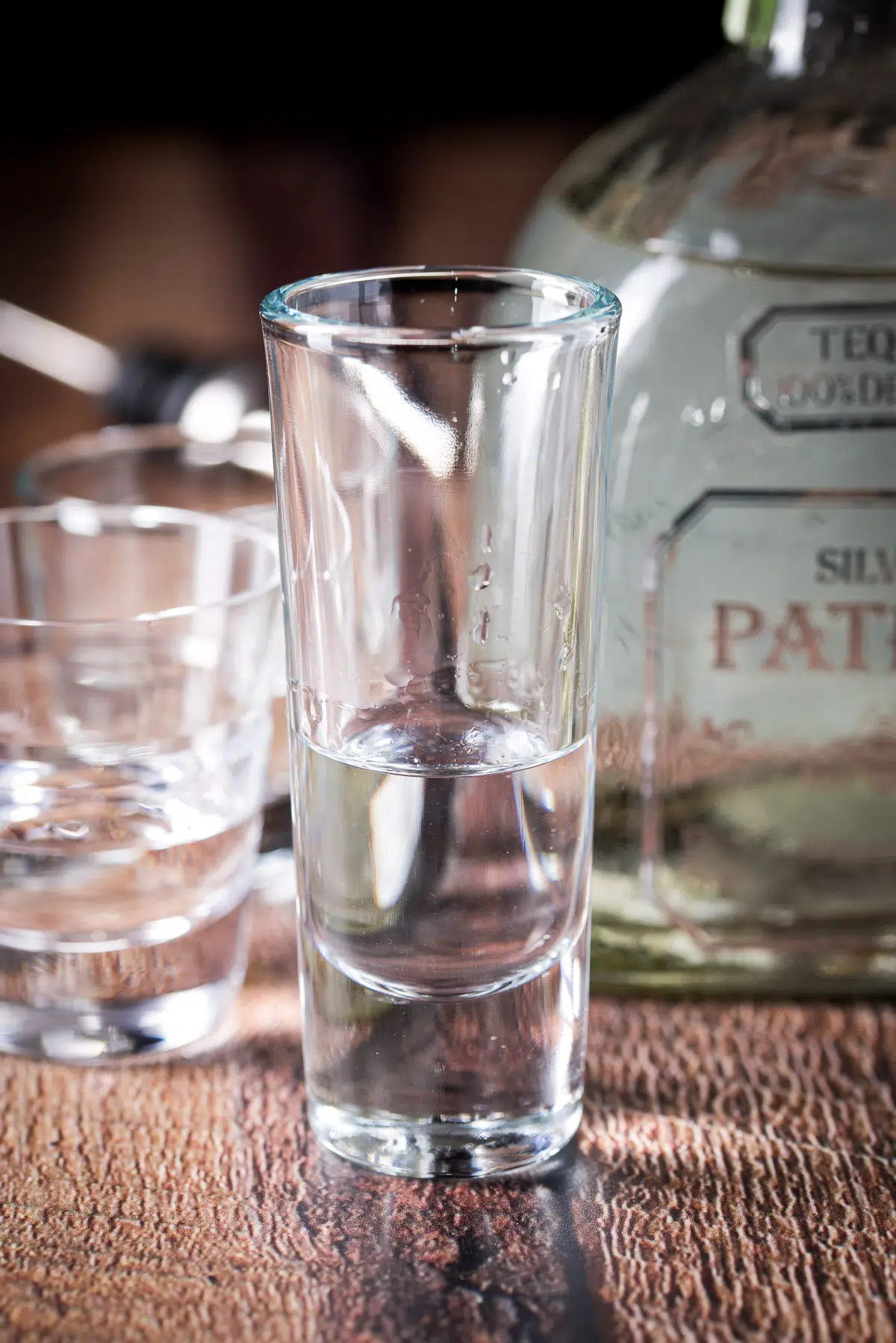 Tequila poured in the shot glasses