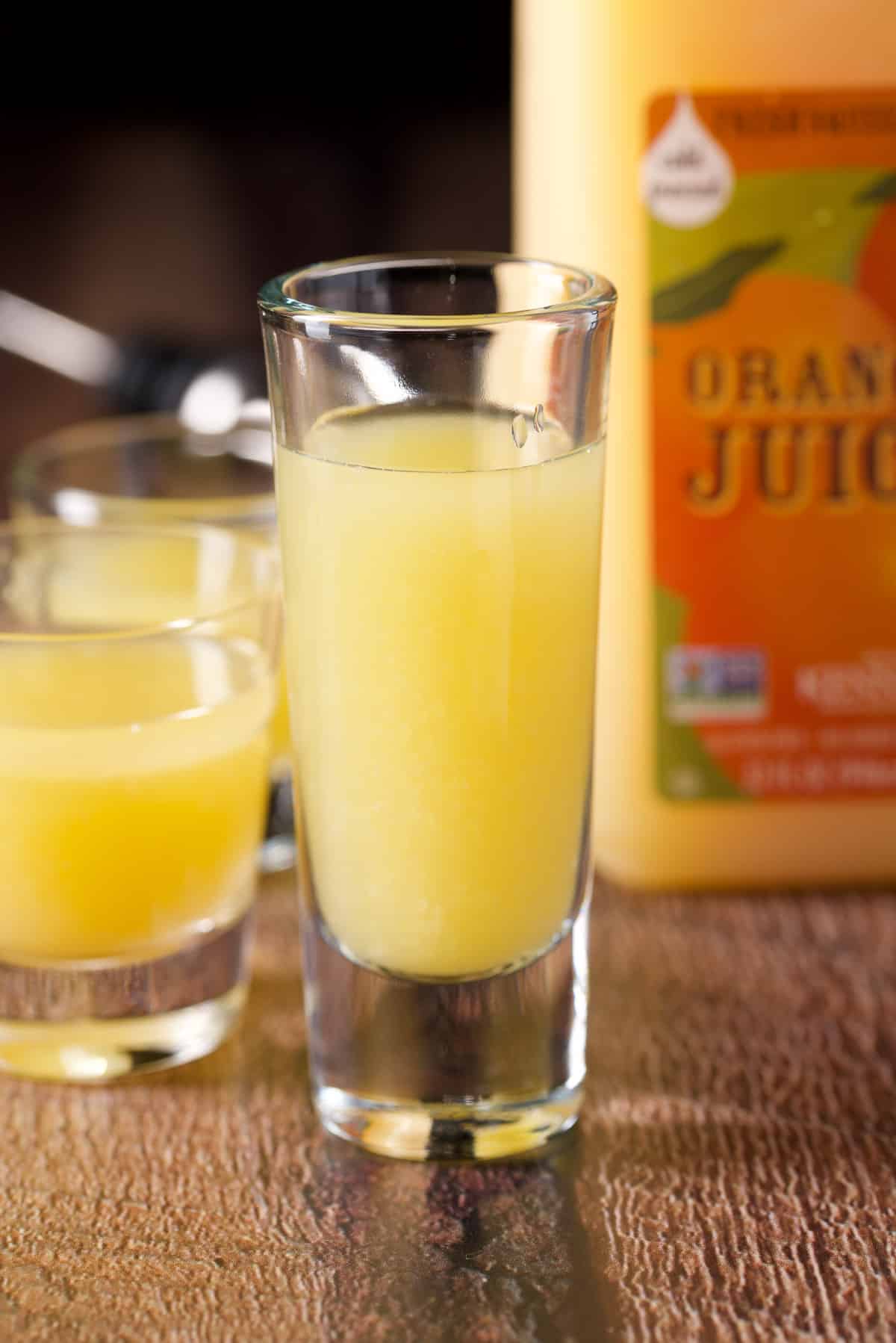 Orange juice poured into the glasses