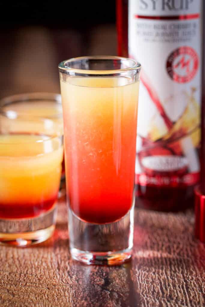 Grenadine layered into the shot glasses