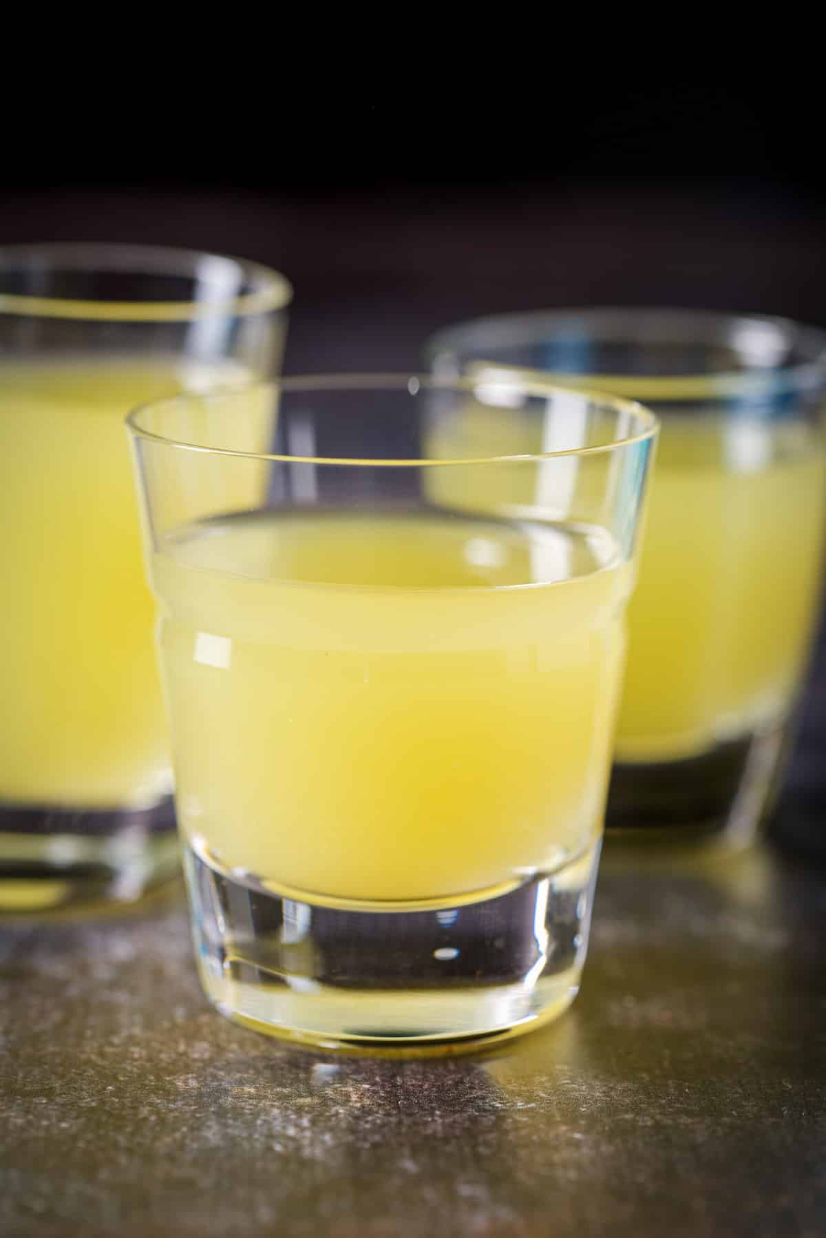 pineapple juice added to the vodka in shot glasses