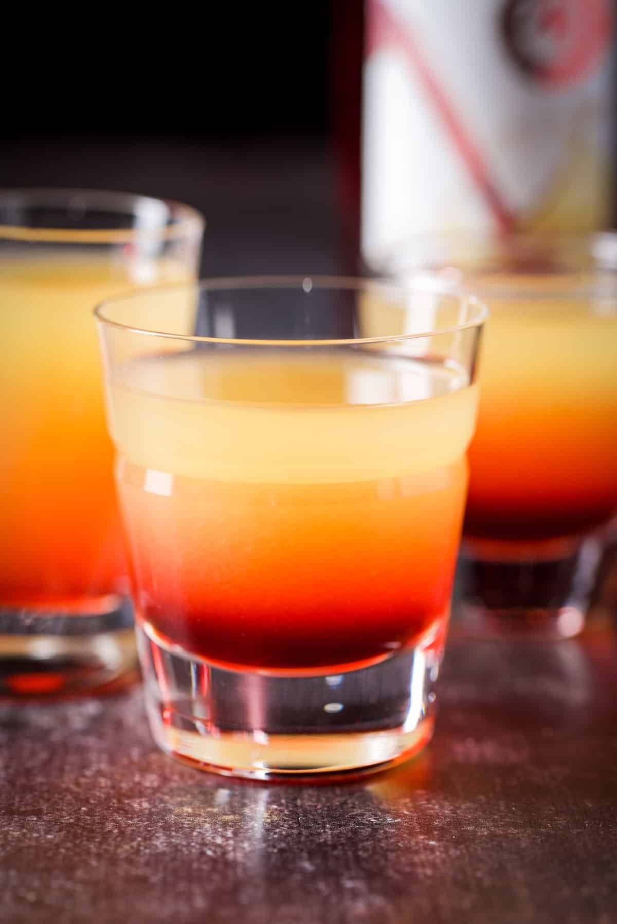 Grenadine layered into the shot glasses