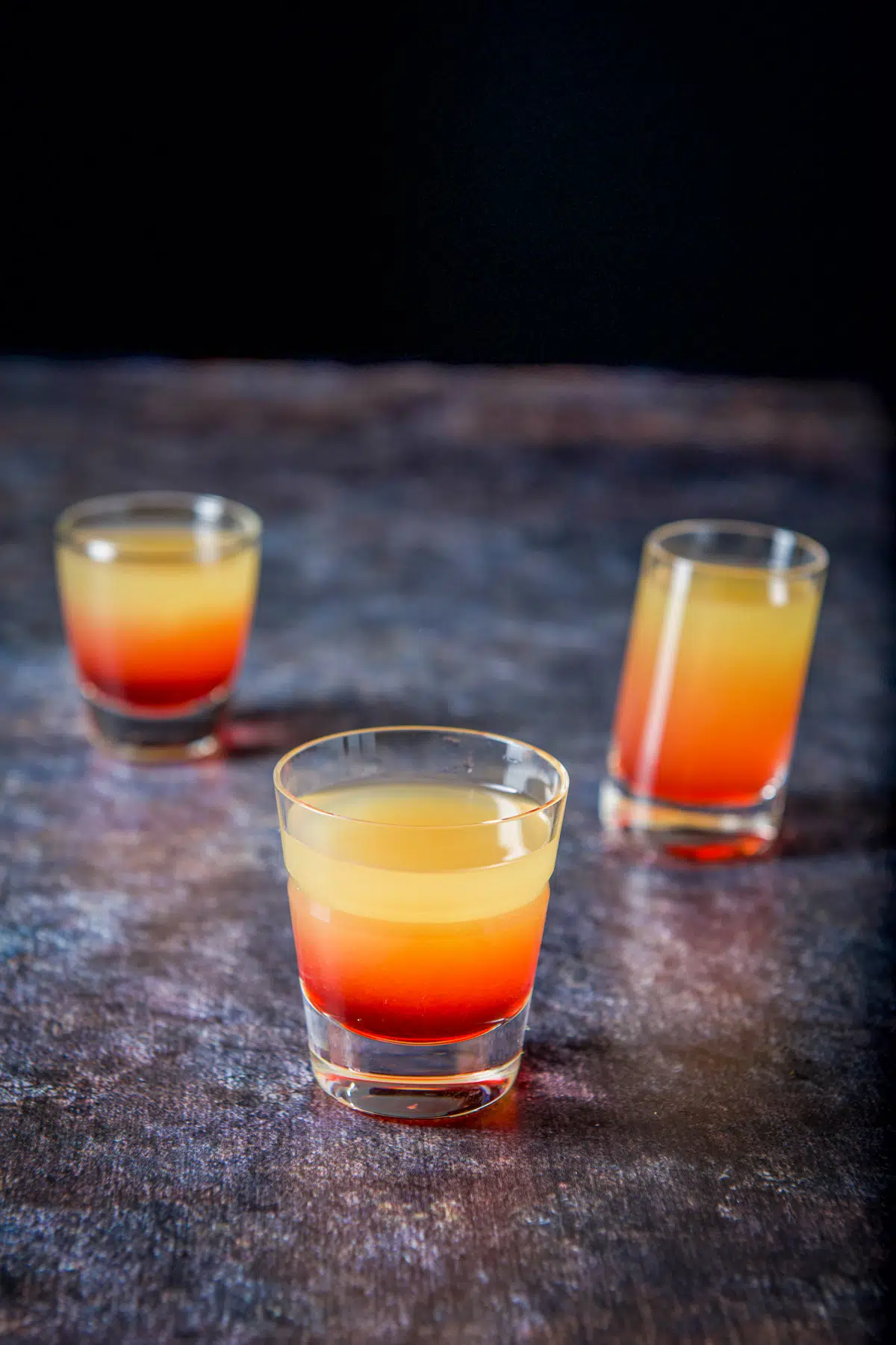 Upper view of the pineapple upside down cake shot - three glasses