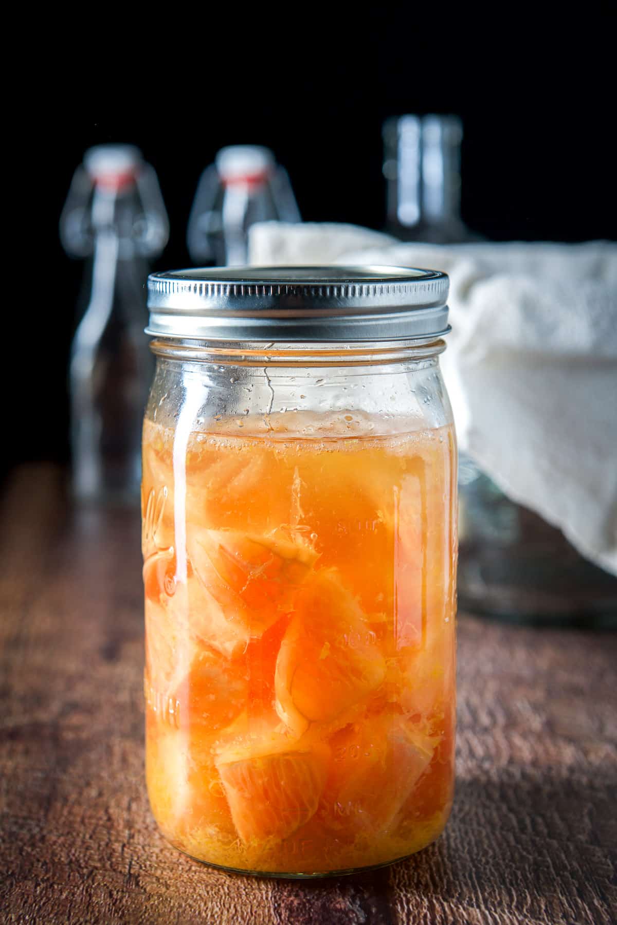 The jar of vodka and grapefruit ready to be processed