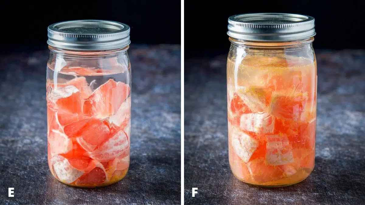 A jar filled with grapefruit and vodka shaken and unshaken