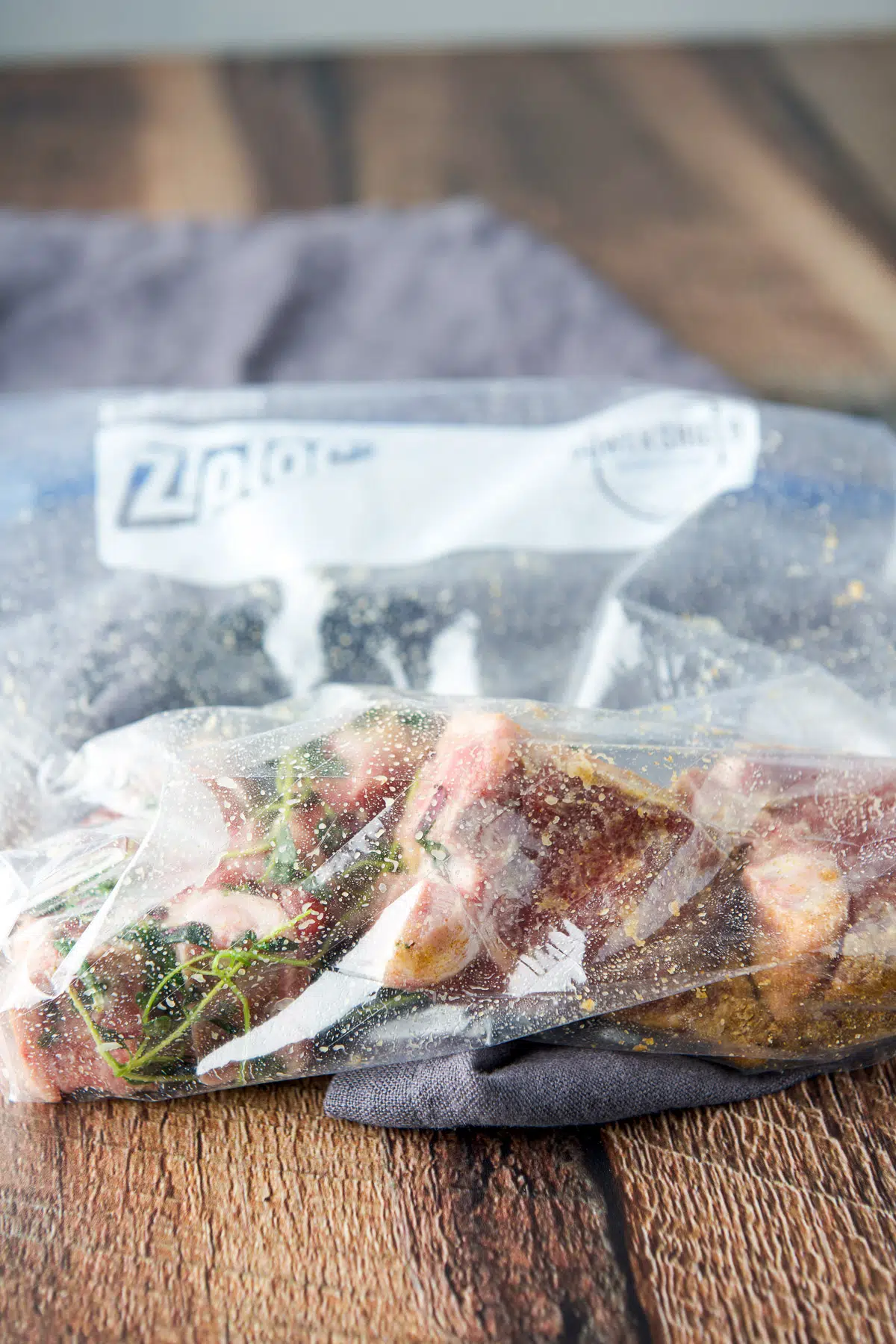 A ziplock back with the chops in it marinating