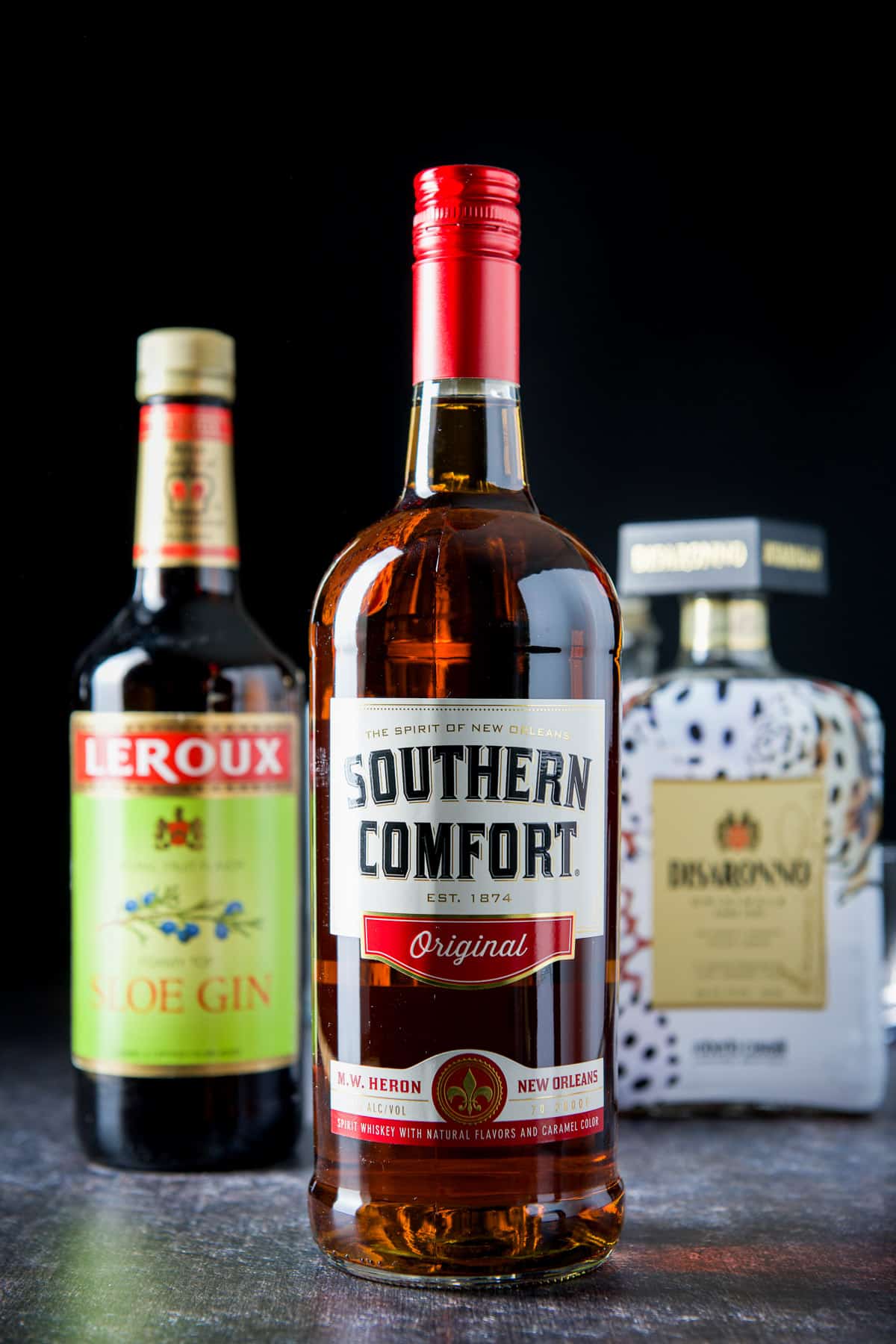 Southern comfort, sloe gin and amaretto on the table