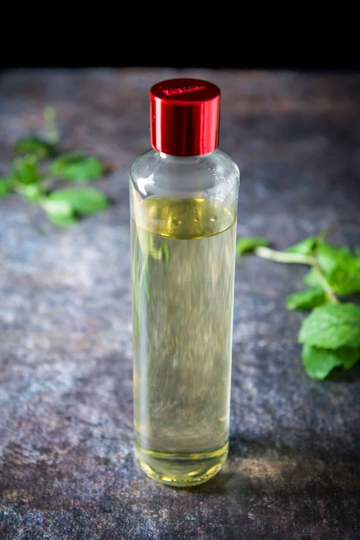 Higher view of the mint simple syrup on the table with mint leaves