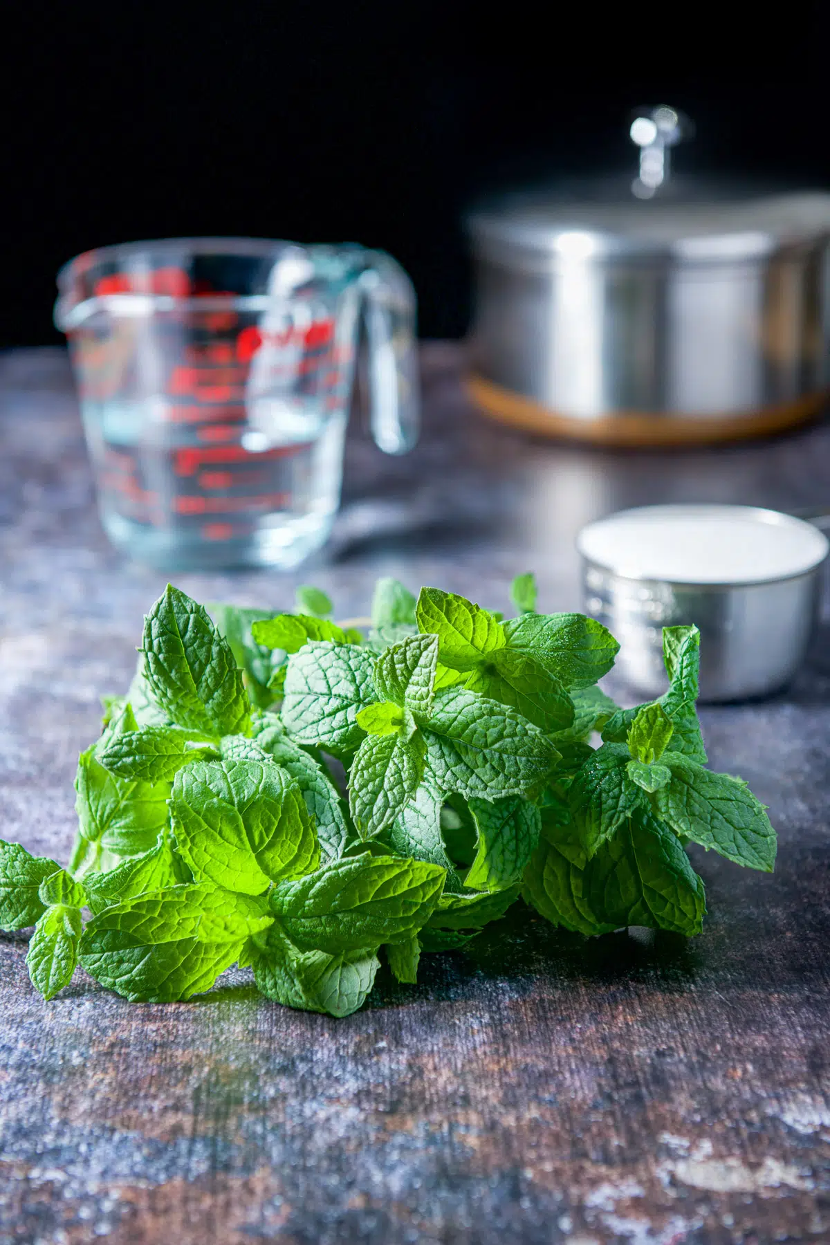Fresh mint leaves, sugar, water and a pan