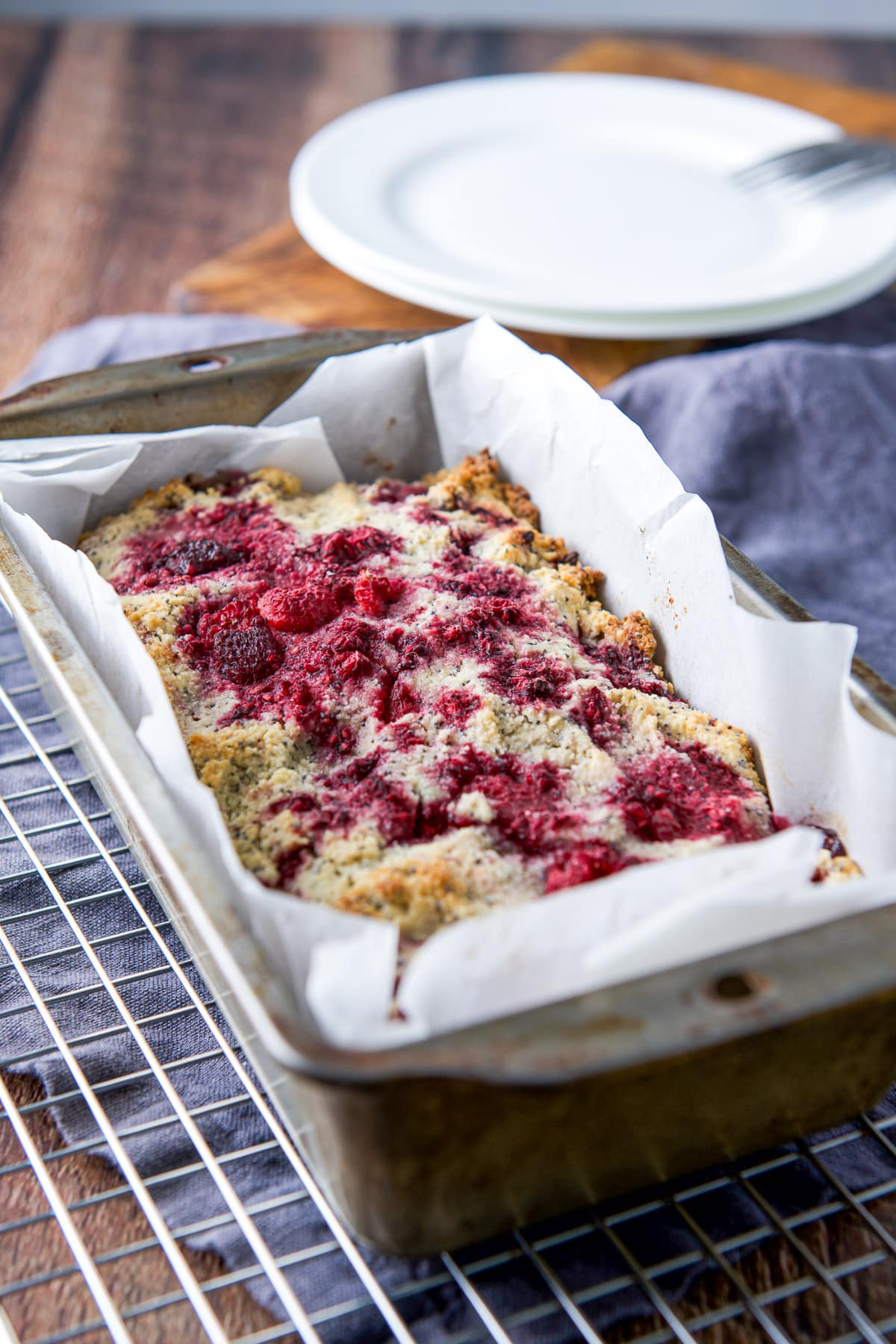 pan of raspberry bread fresh out of the oven and cooling on a rack
