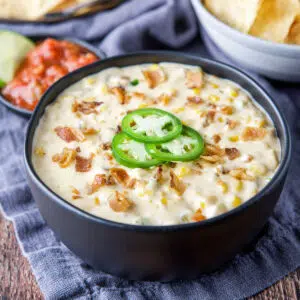 square photo of the corn dip in a black bowl