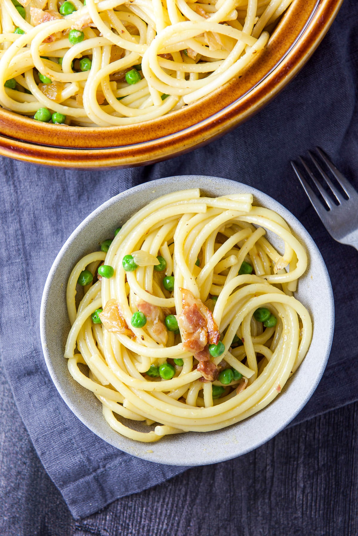 Overhead view of the grey and brown bowl filled with the pasta dish