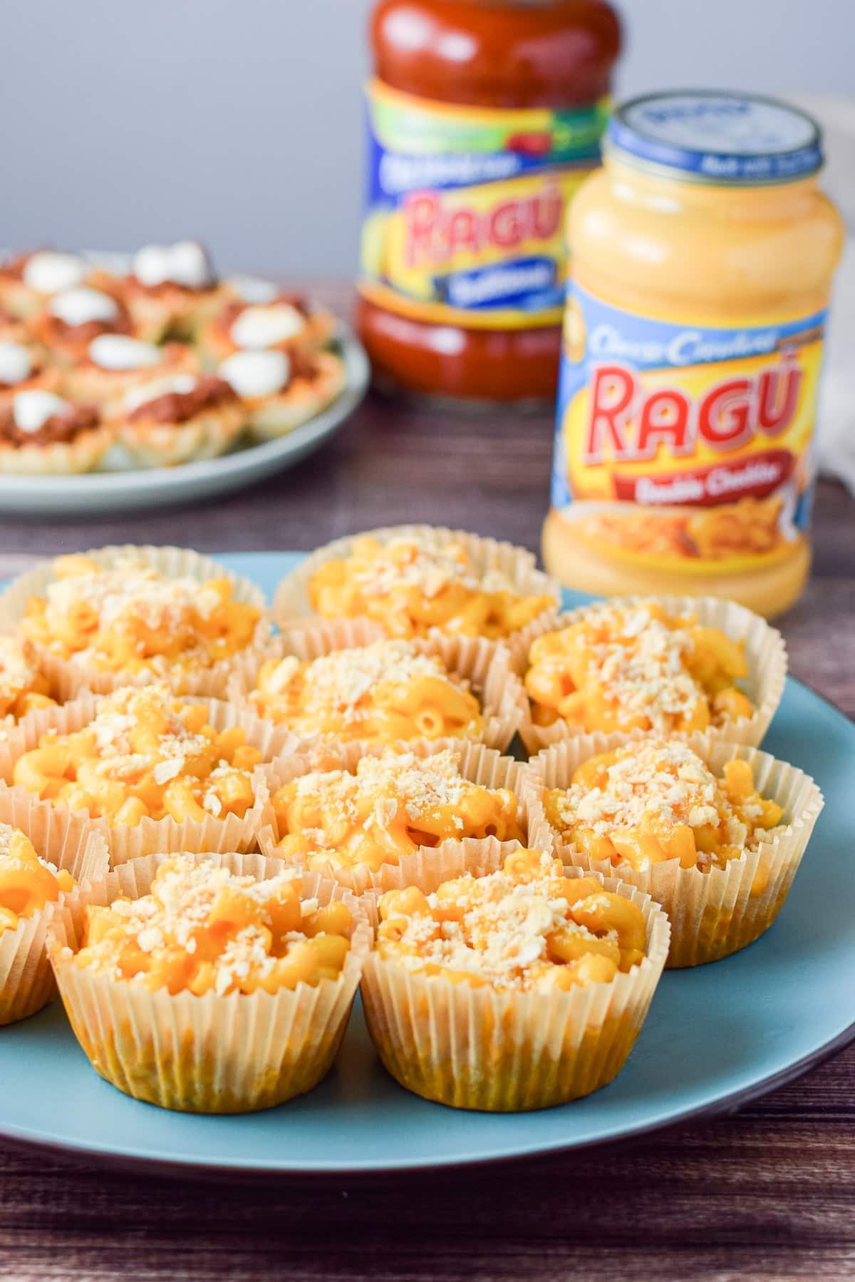 A blue plate with muffin cups filled with the appetizer