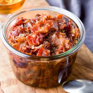 A jar filled with bacon jam with bourbon - square