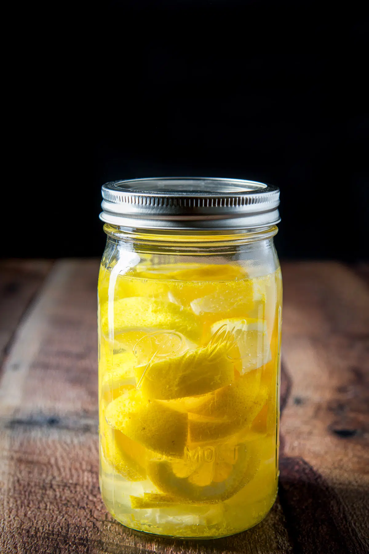The jar with vodka and lemon shaken