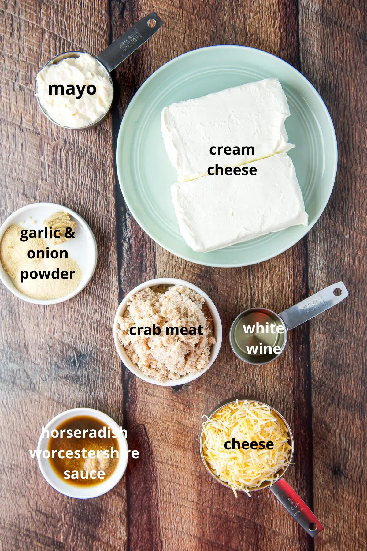 Ingredients for the dip - cream cheese, mayo, spices, crabmeat, wine, horseradish, Worcestershire sauce, and cheese