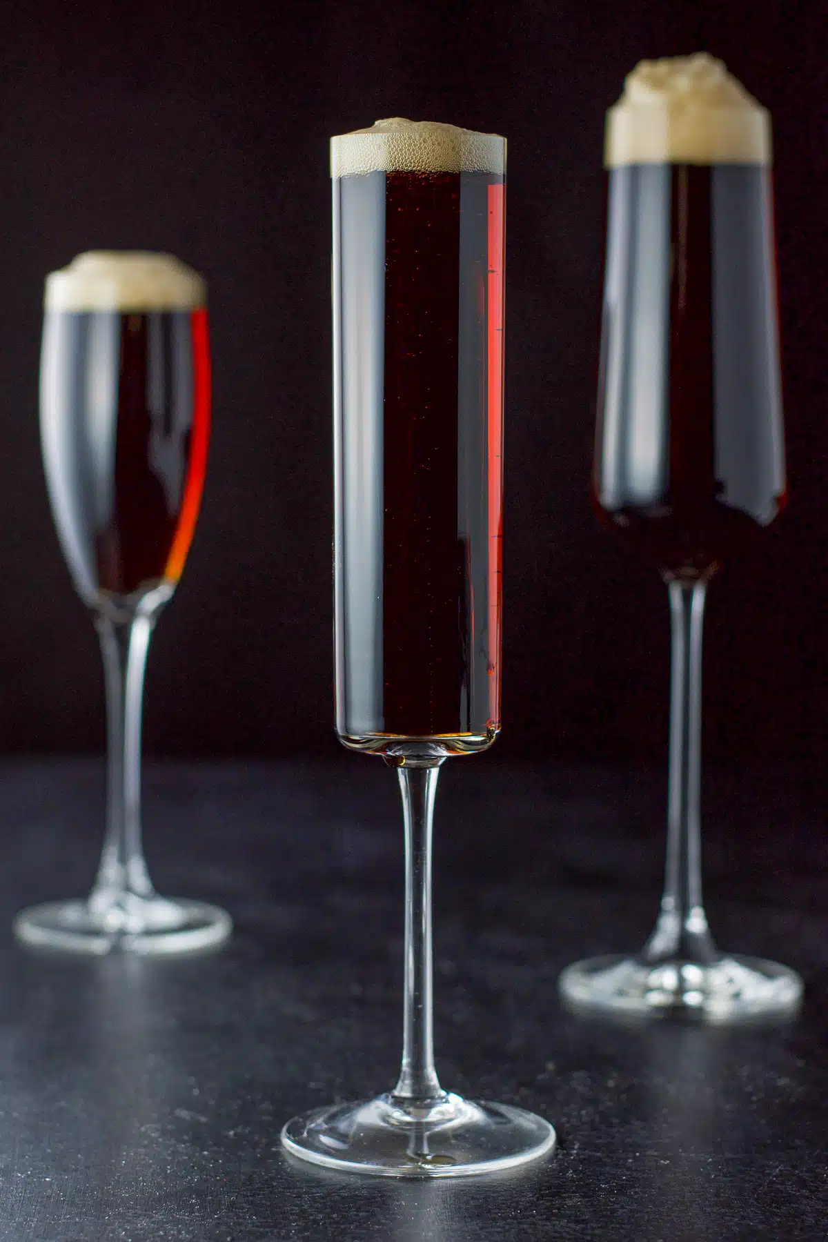 Vertical view of the reddish cocktail in champagne flutes