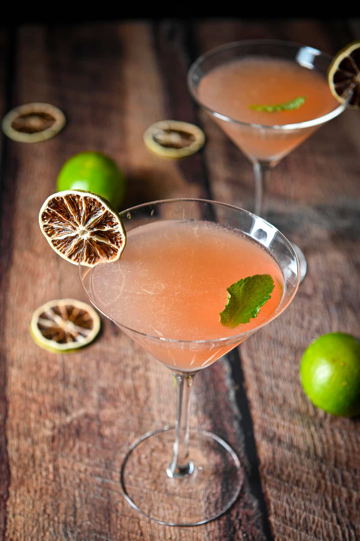 Overhead view of the berry drink with limes and mint as garnish