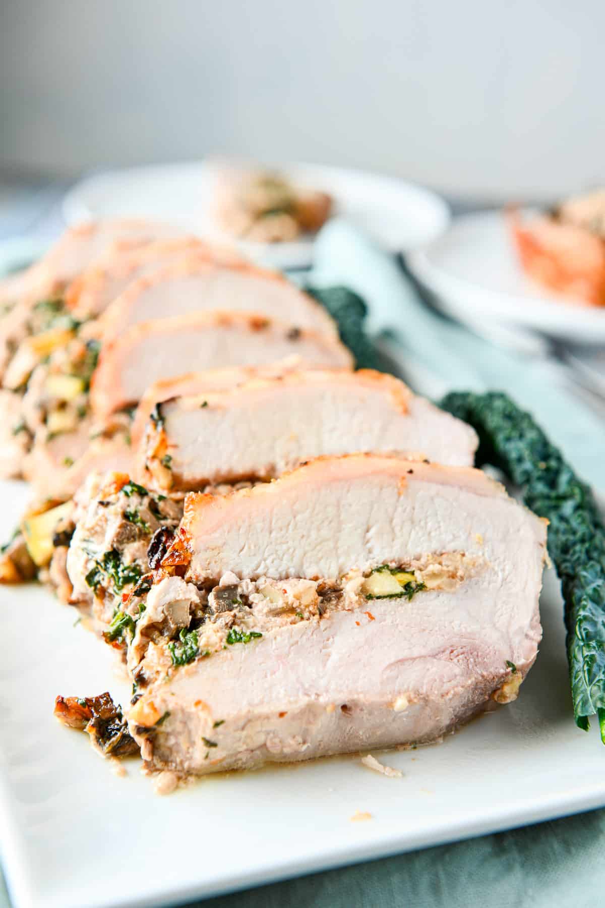 Close-up of the sliced stuffed meat on a platter