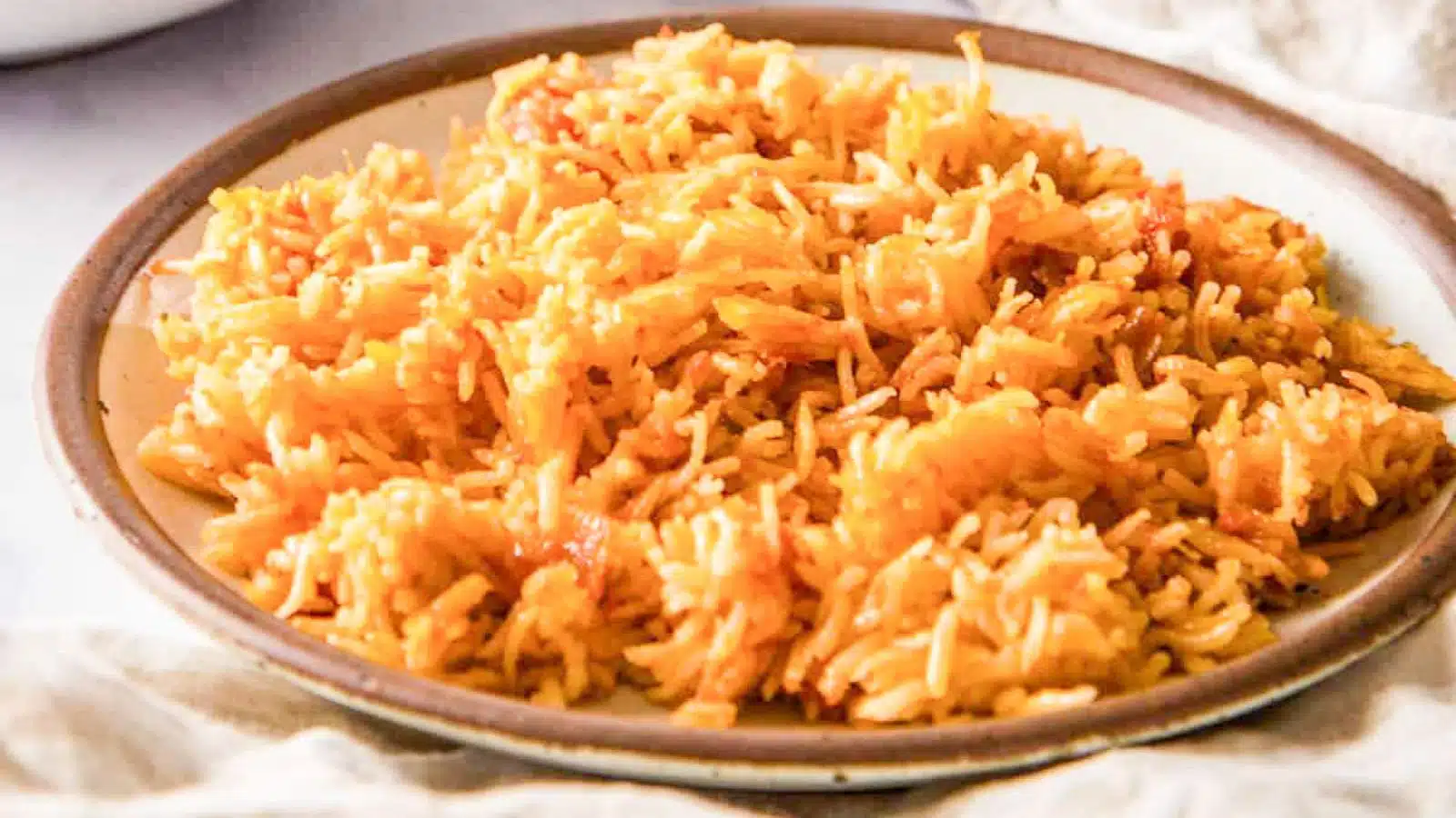 jollof rice on a brown plate