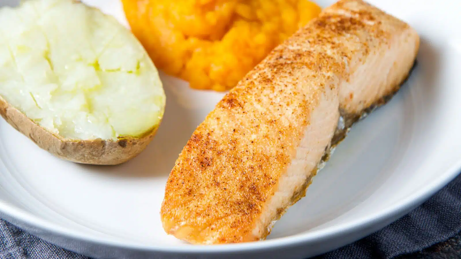 Potato and squash on a plate with the salmon