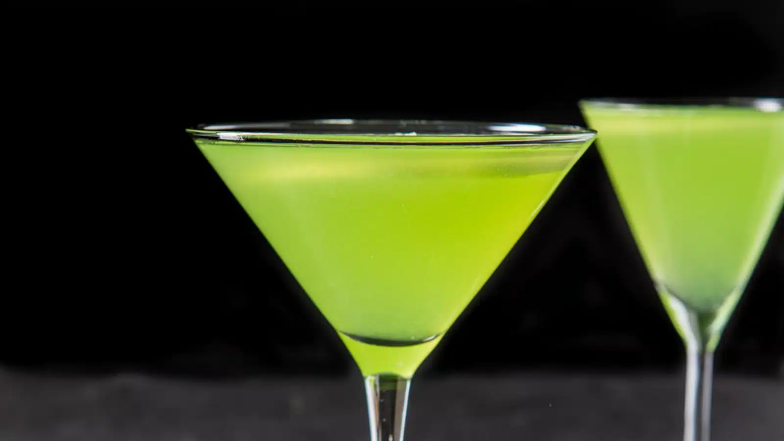Green cocktails in two martini glasses