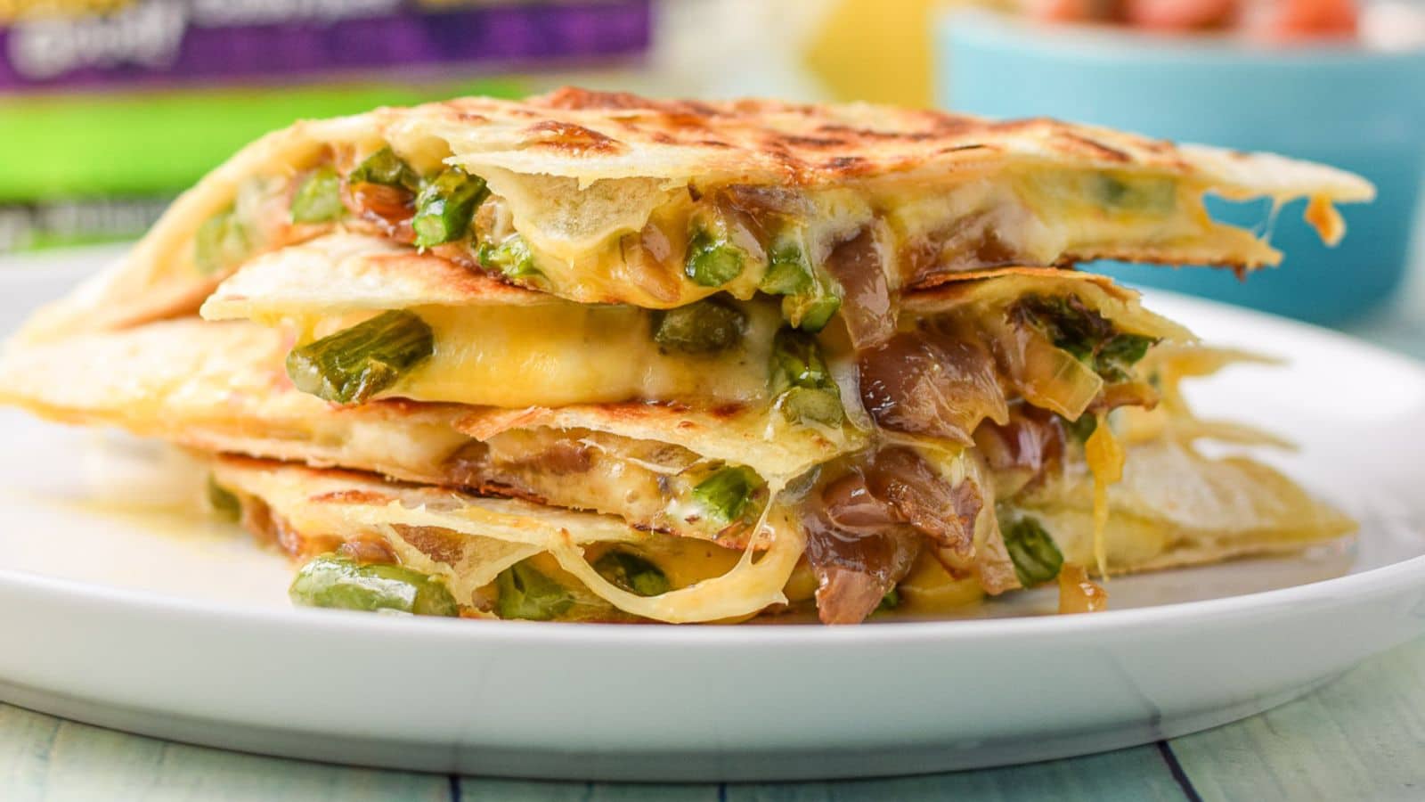 A horizontal image of stacked vegetarian quesadilla quarters