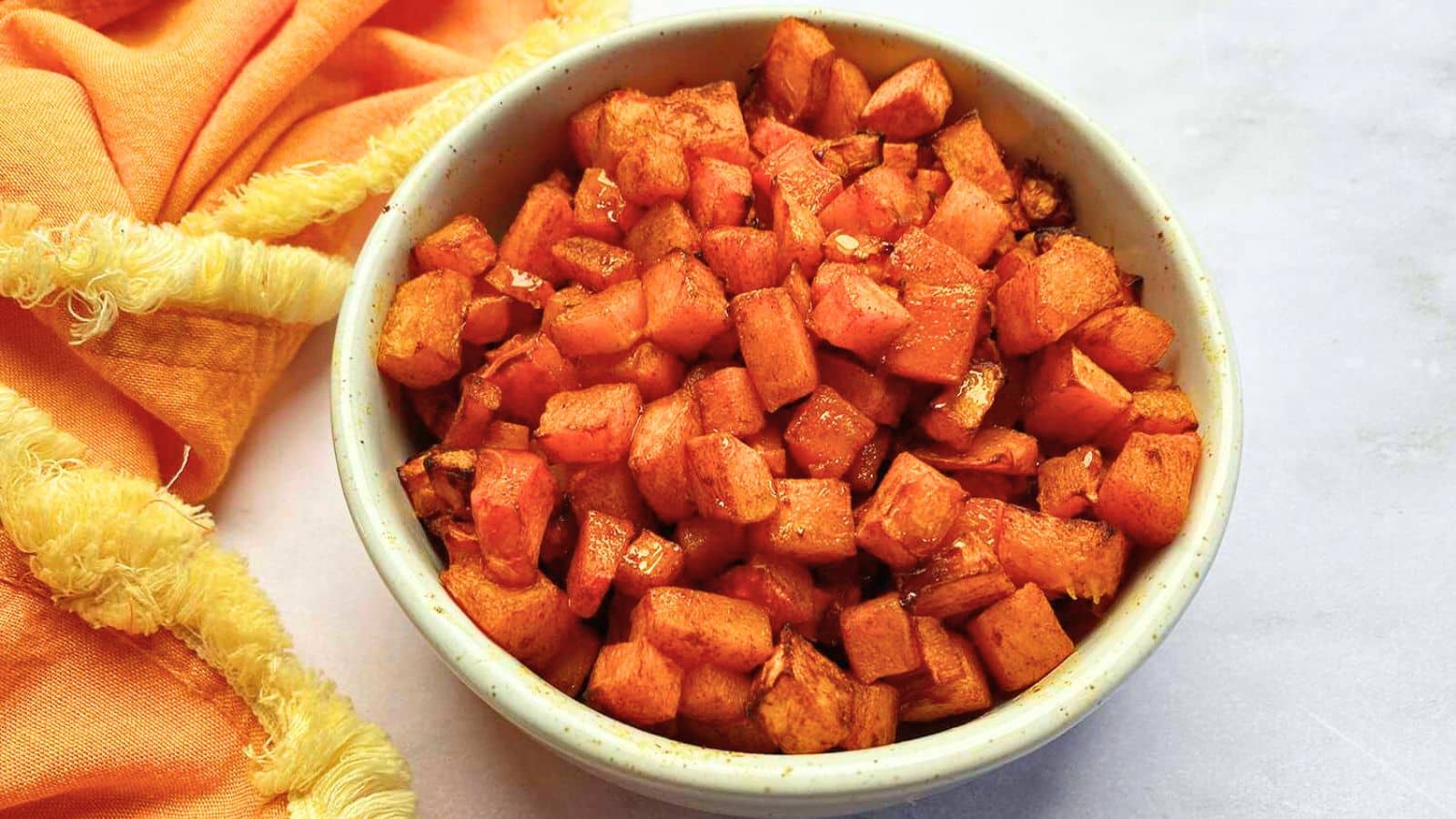 A bowl of butternut squash cut in small chunks