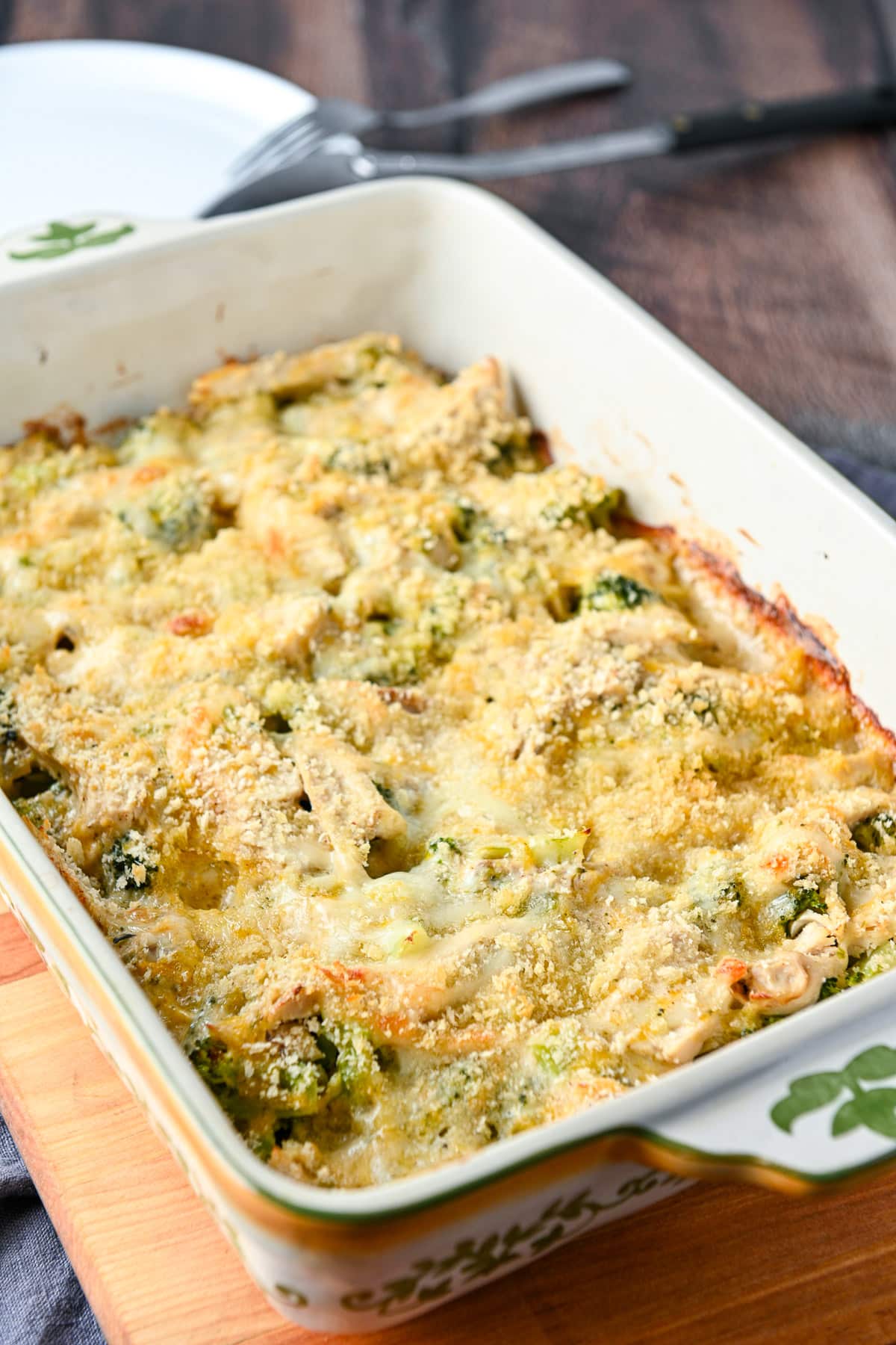 A thirteen by nine ceramic dis with the cooked chicken broccoli