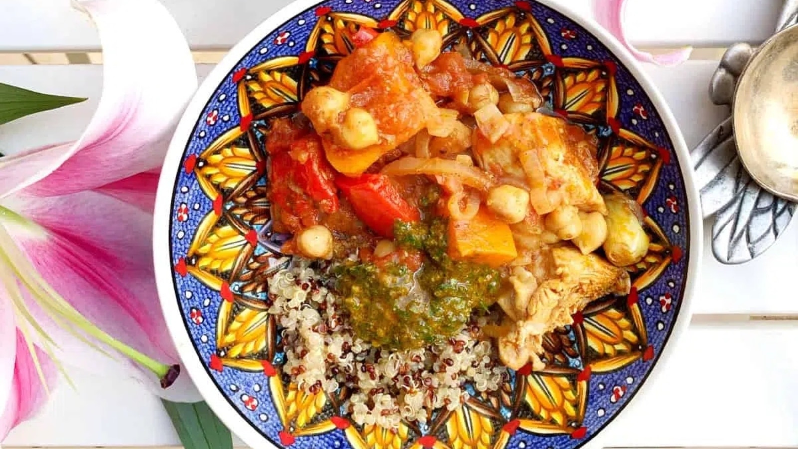 overhead view of a chicken dish with quinoa and sauce