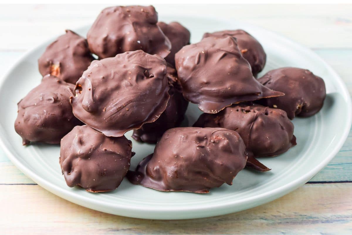 a green small plate with chocolate covered balls