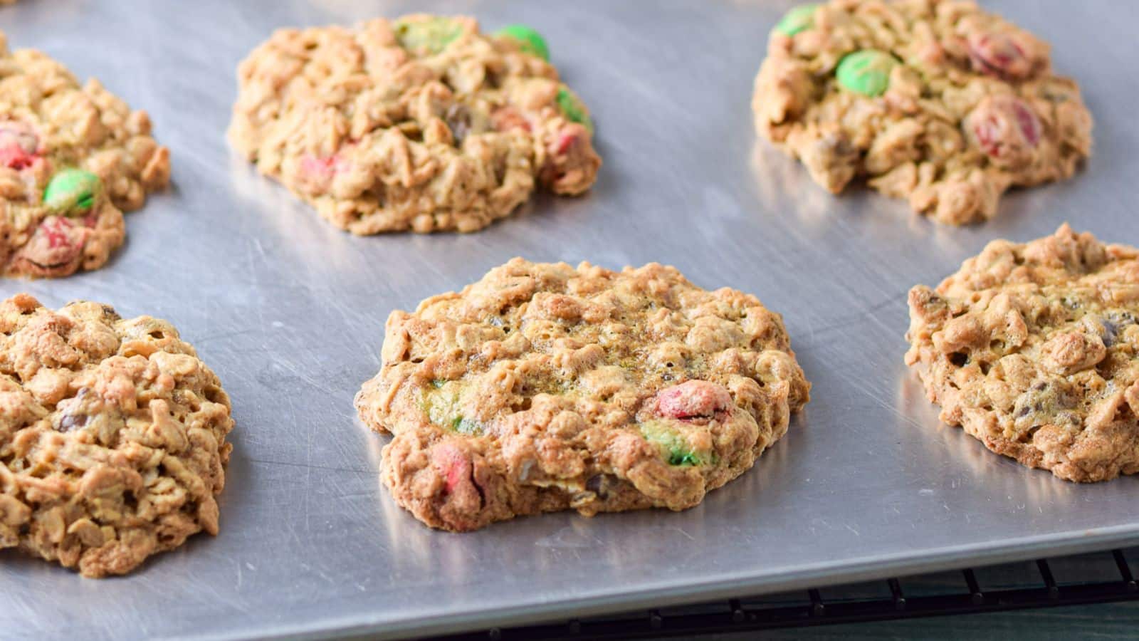 A baking sheet with the m & m cookies on it