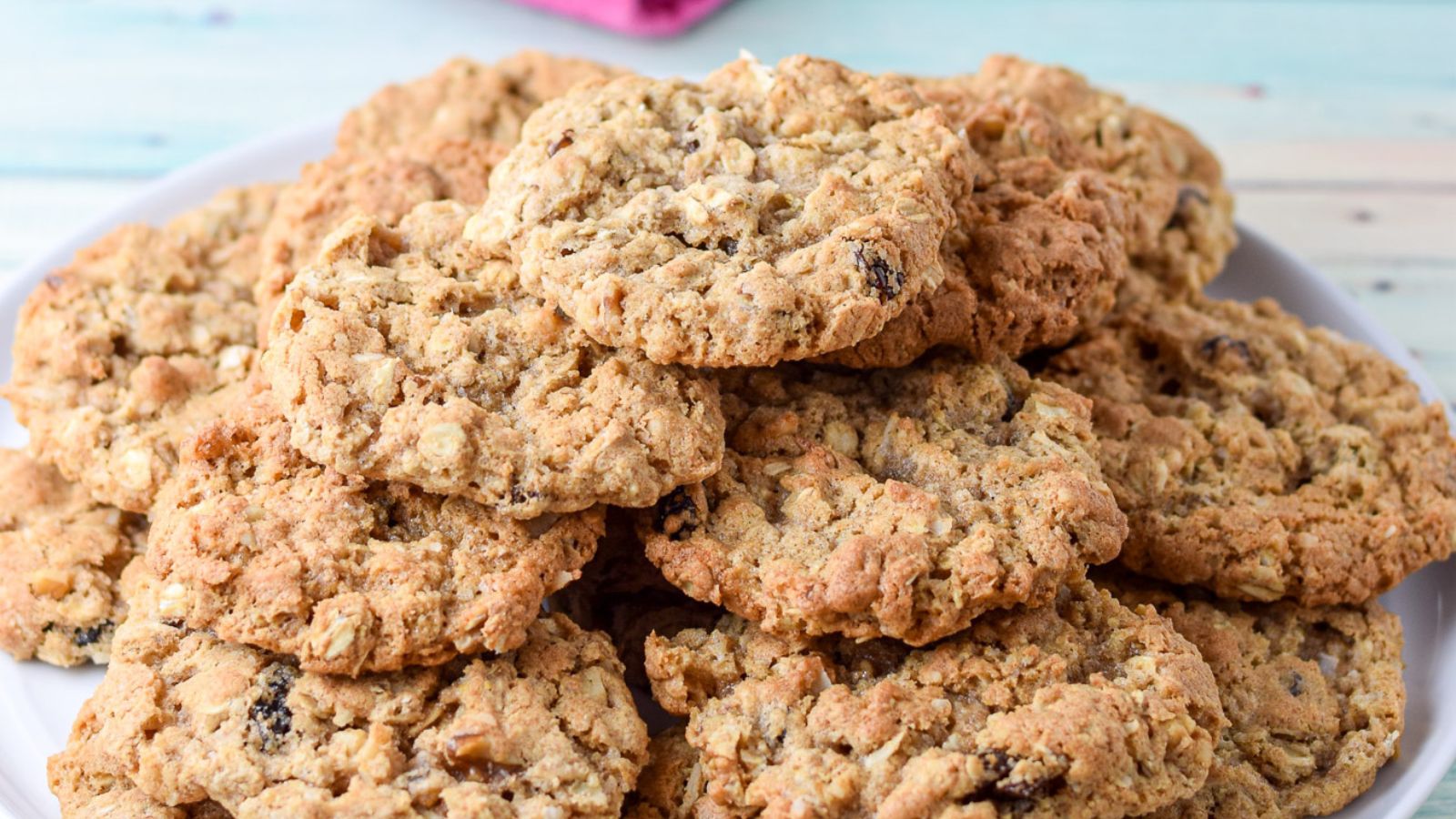 a plate with a pile of oatmeal cookies on it